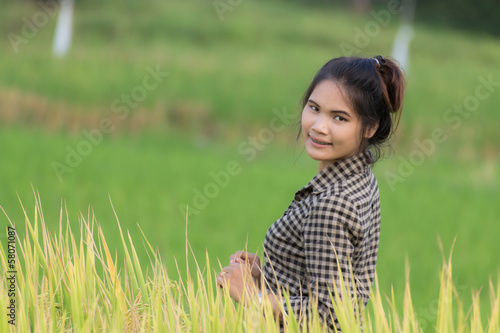 Woman farmer in Green Cornfield