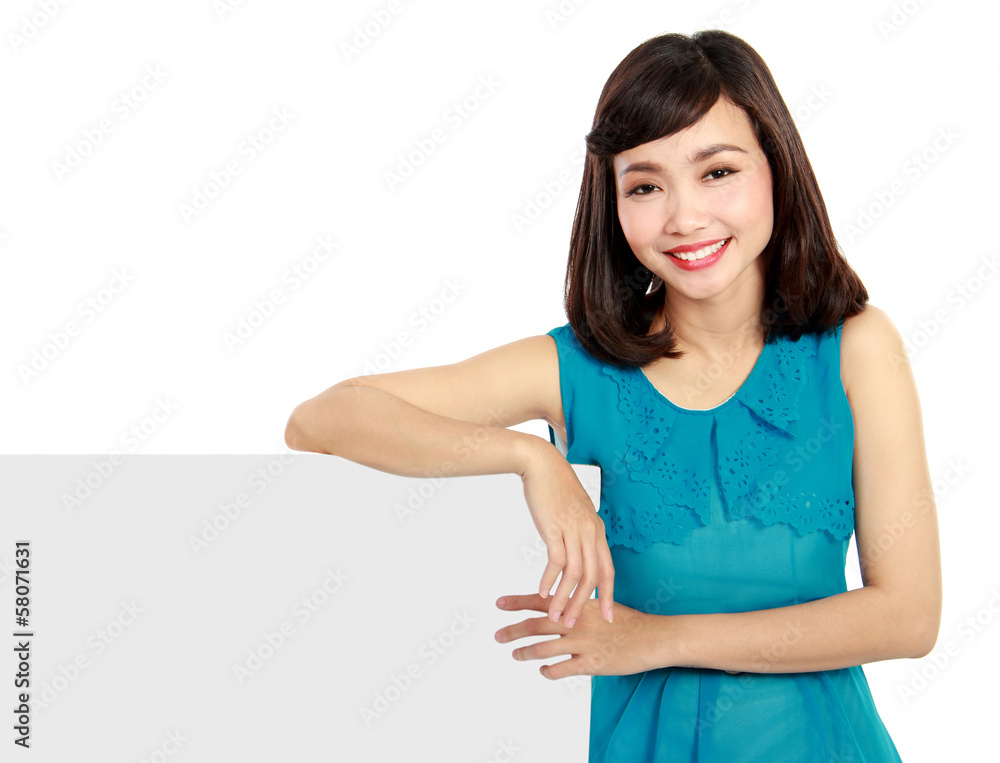 Happy smiling young woman showing blank signboard Happy smiling young woman showing blank signboard