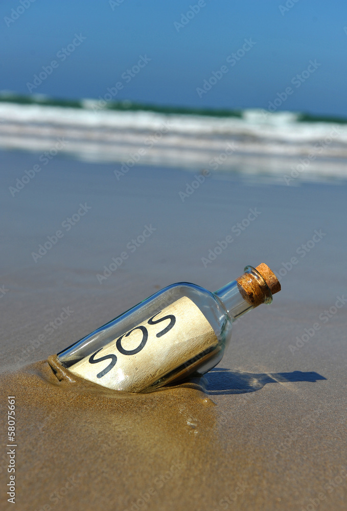 Distress message in a bottle on the deserted beach Distress message in a bottle on the deserted beach