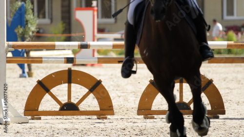 Horse jump a hurdle in competition photo