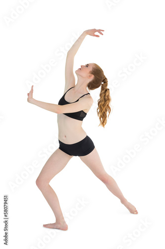 Full length of a sporty young woman stretching © lightwavemedia