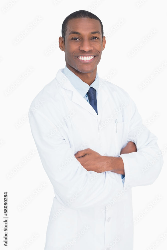 Portrait of a smiling male doctor with arms crossed Portrait of a smiling male doctor with arms crossed