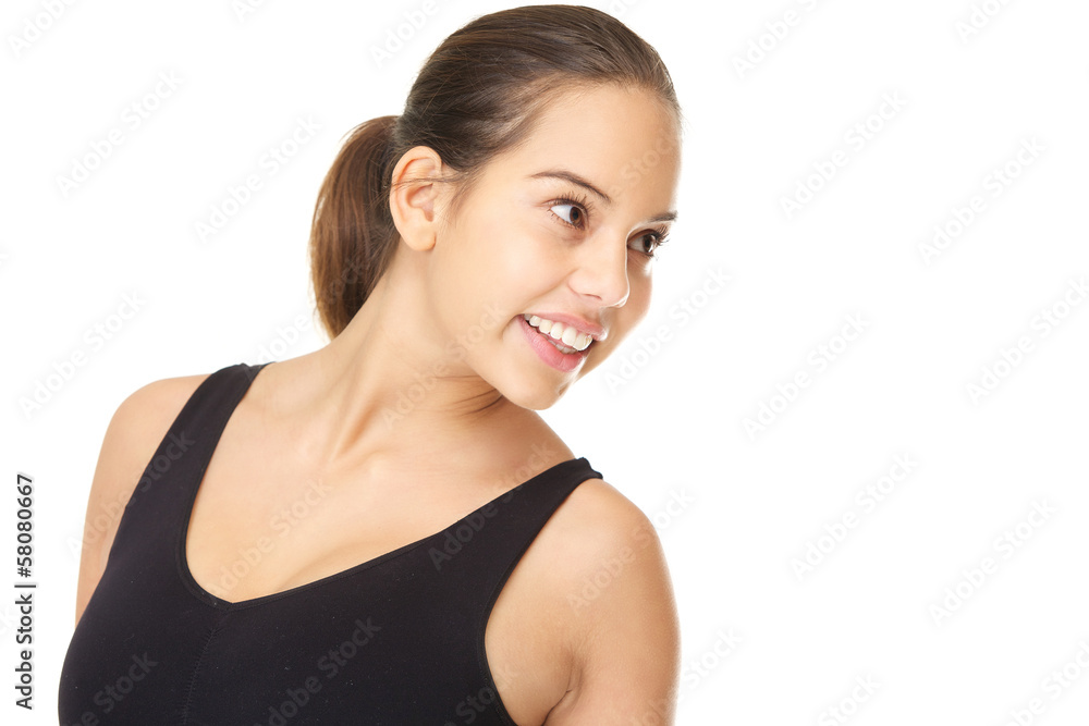 Happy young woman smiling and looking away Happy young woman smiling and looking away