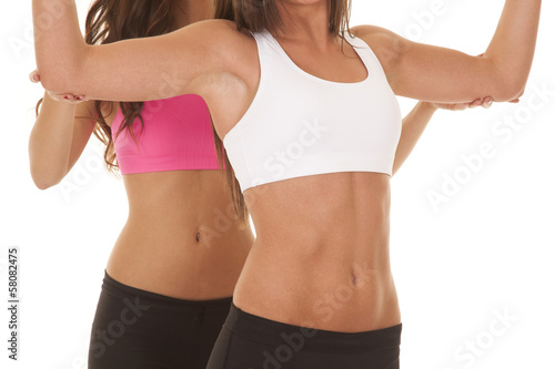 Two women fitness bodies train