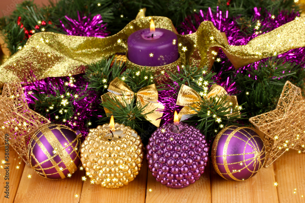 Christmas composition  with candles and decorations in purple