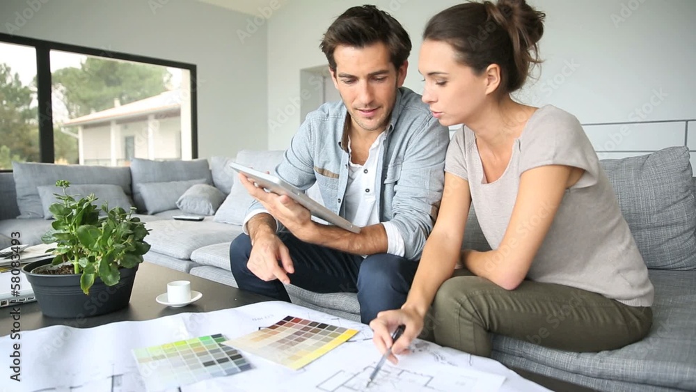 Couple searching ideas to decorate new home
