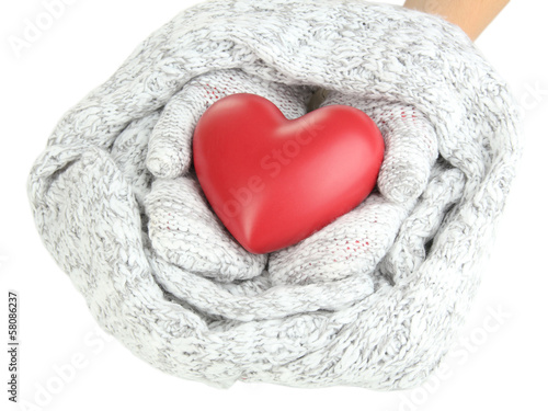 Female hands in mittens with heart  close-up
