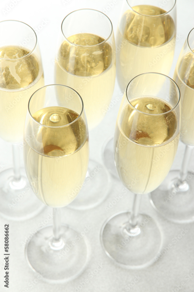 Glasses with champagne on shiny background Glasses with champagne on shiny background