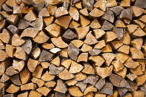 firewood - the firewood cut and split into parts. firewood is piled