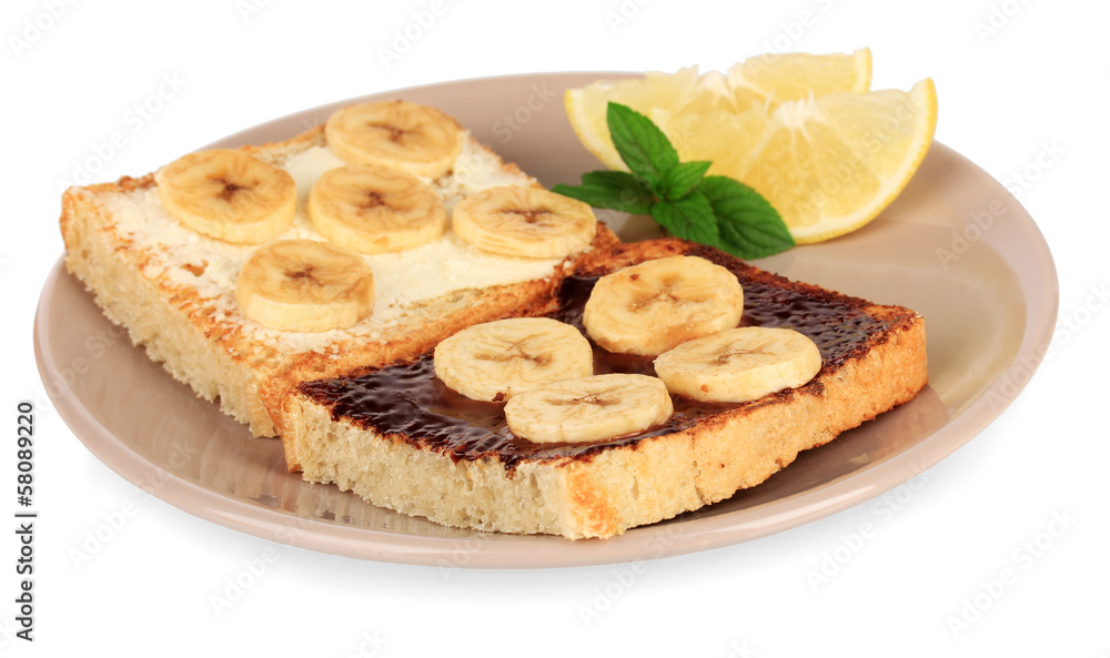 Delicious toast with bananas on plate isolated on white Delicious toast with bananas on plate isolated on white