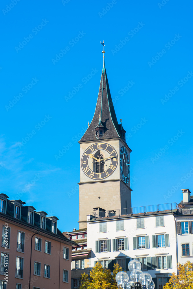 Clock tower over the buildings in Zurich, Switzerland Clock tower over the buildings in Zurich, Switzerland