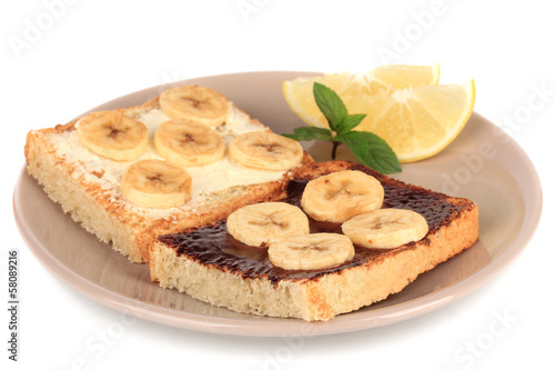 Delicious toast with bananas on plate isolated on white