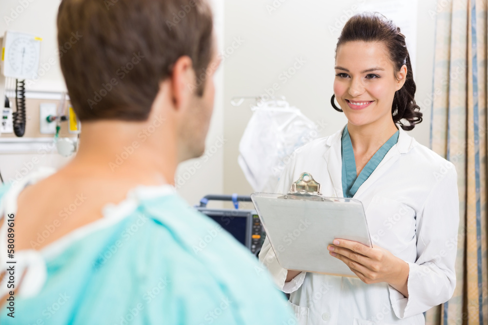 Doctor With Clipboard Examining Patient's Medical Report Doctor With Clipboard Examining Patient's Medical Report