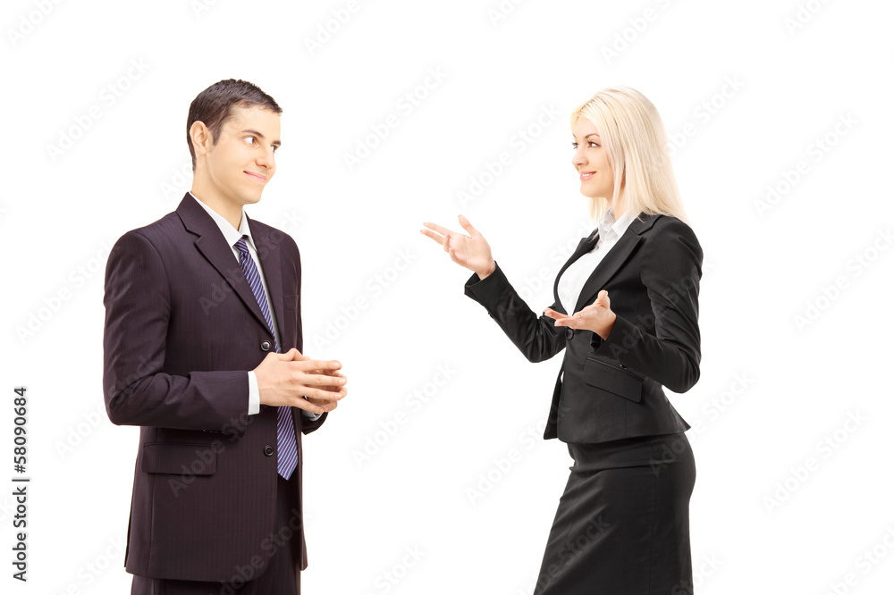 Two businesspeople having conversation together Two businesspeople having conversation together