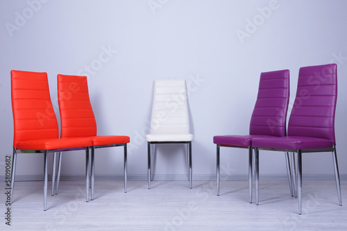 Modern  color chairs on wall background