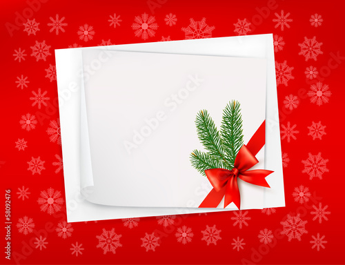 Christmas red background with sheet of paper and red bow and rib