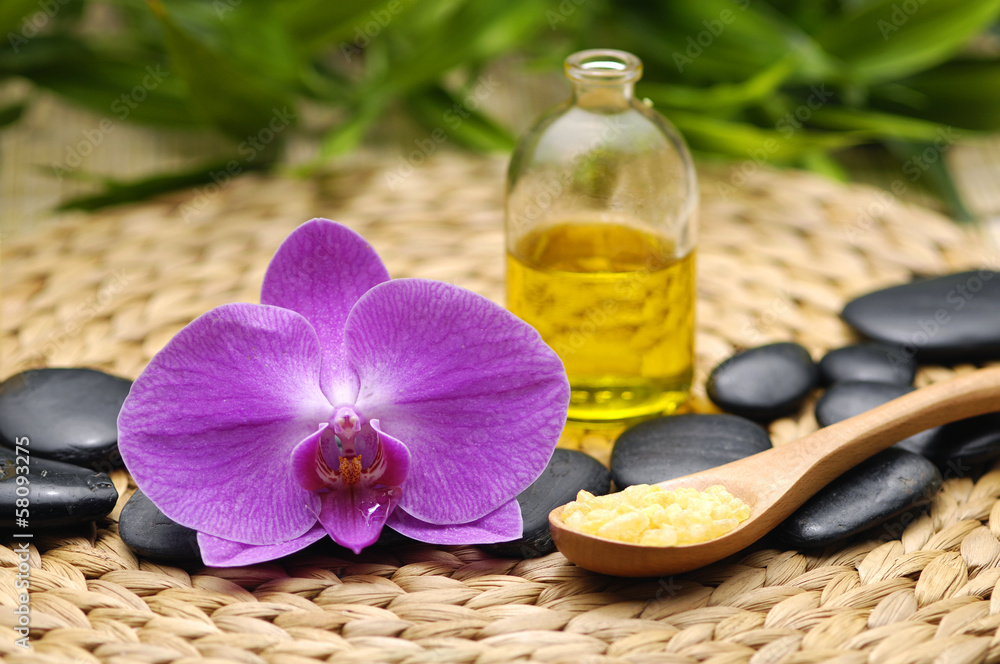 spa concept with orchid with spa stone, candle, massage oil spa concept with orchid with spa stone, candle, massage oil