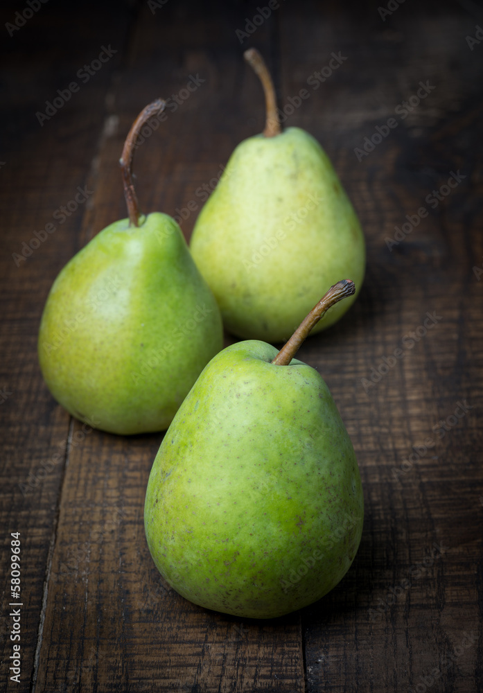 Pears on a rustic wooden kitchen table Pears on a rustic wooden kitchen table