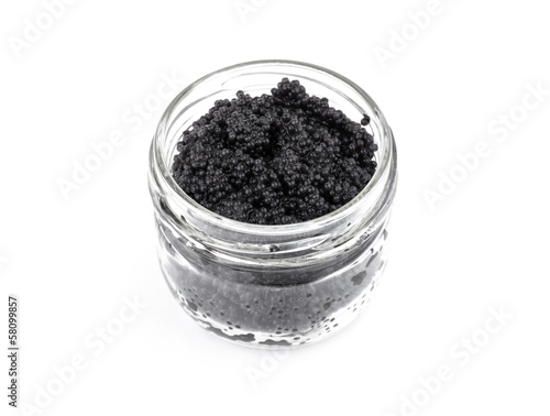 Black caviar in a glass jar isolated on white
