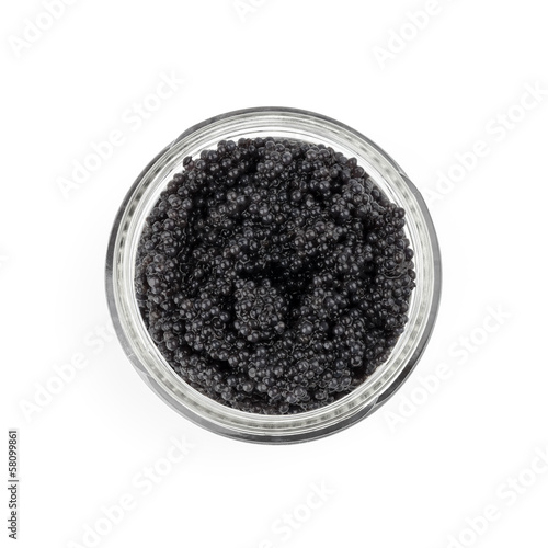 Black caviar in a glass jar. Top view isolated on white