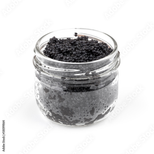 Black caviar in a glass jar isolated on white background