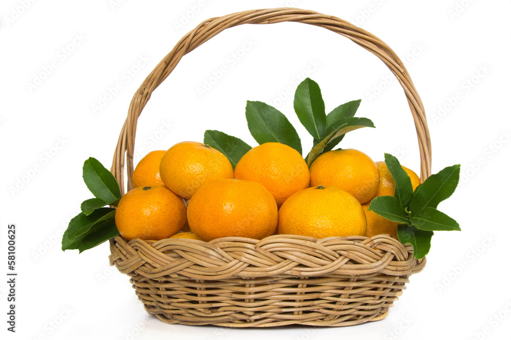 A basketful of mandarin oranges and leafs on white background. A basketful of mandarin oranges and leafs on white background.
