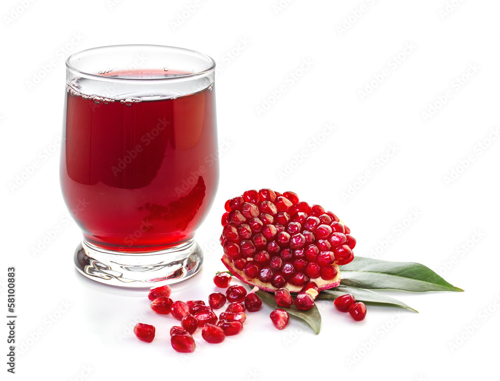 Ripe pomegranate and glass of juice on a white background Ripe pomegranate and glass of juice on a white background