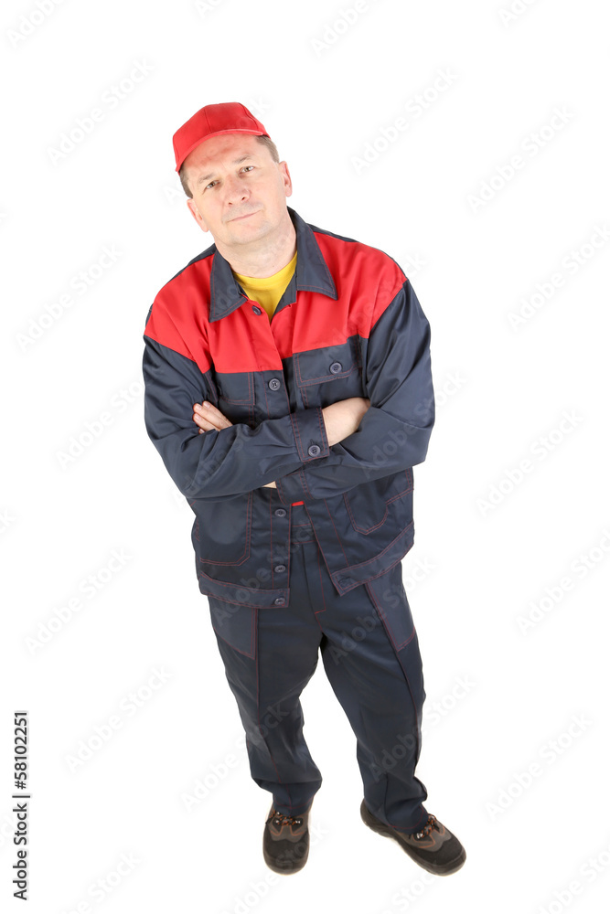 Man in working clothes with crossed arms. Man in working clothes with crossed arms.