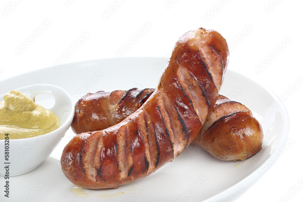 Delicious fried sausage on plate Delicious fried sausage on plate