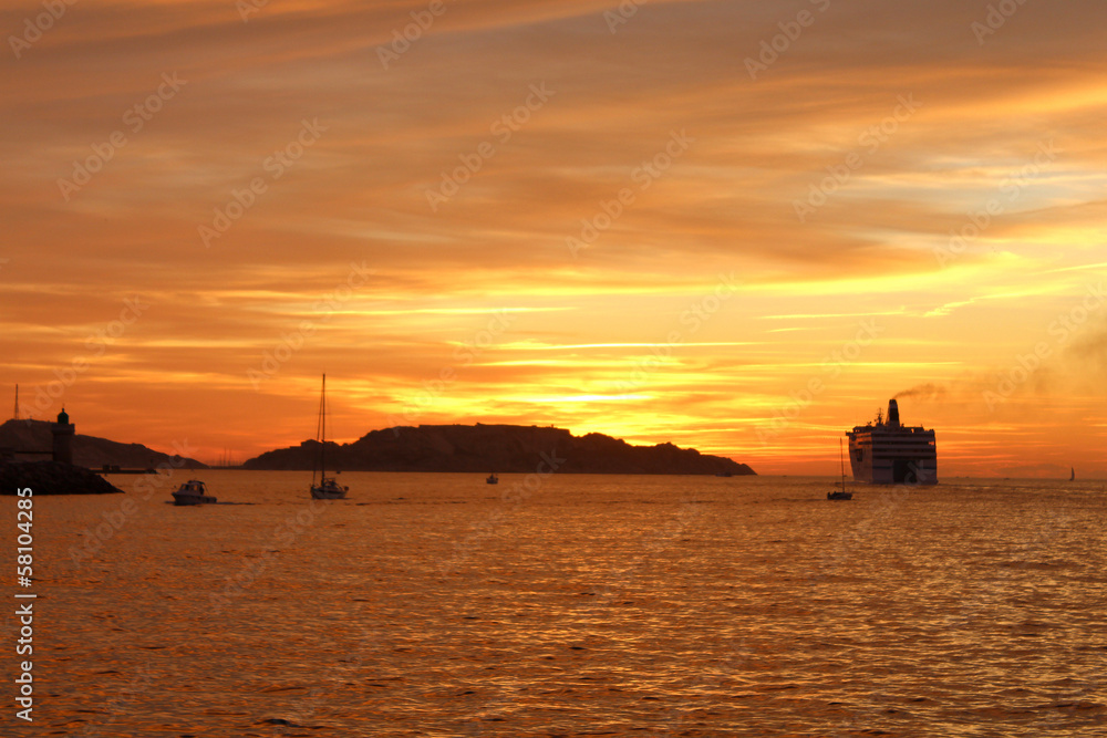 Cruise ship in port of Marseille at sunset - France