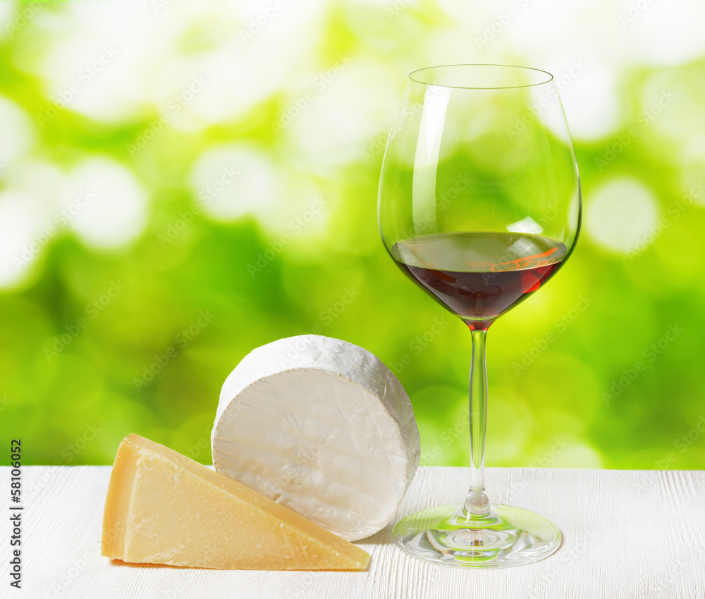 Cheese and glass of wine on nature background Cheese and glass of wine on nature background