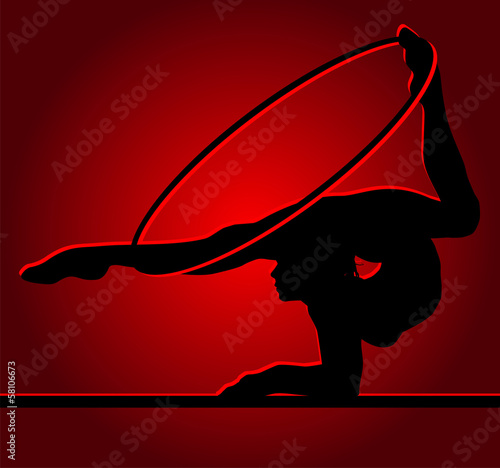 Flexible gymnast with hoop on a red background