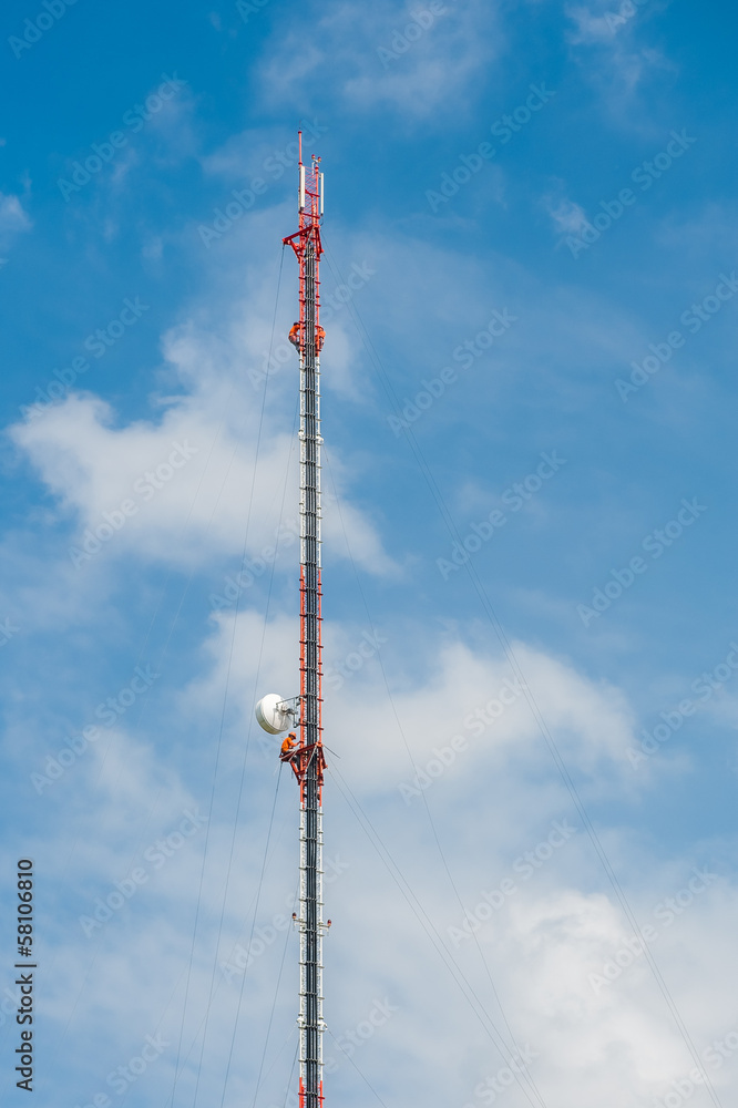 Tower climber and working on cellular tower system. Tower climber and working on cellular tower system.