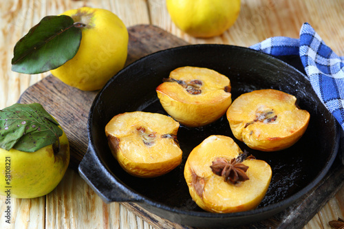 baked quince with honey in a pan