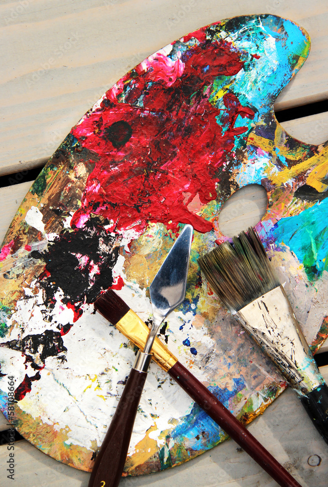 Art palette and mix of paintbrushes