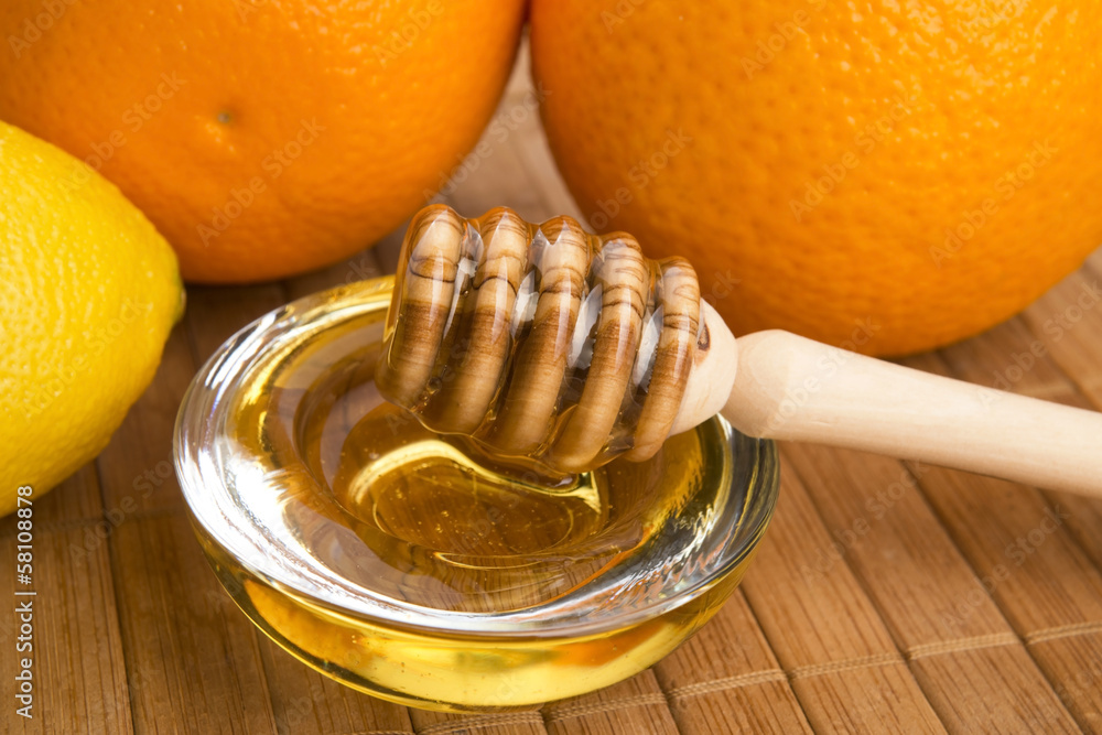 fresh honey with lemon and orange fruits fresh honey with lemon and orange fruits