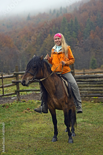 Horseback riding in the mountains © kyslynskyy