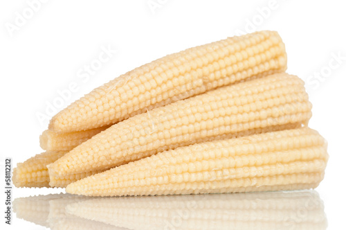 Baby corn on a white reflective background