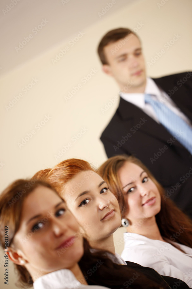 Team looking at camera in the office Team looking at camera in the office