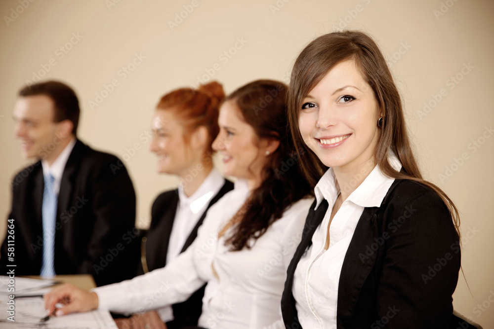 Young businesswoman looking at camera Young businesswoman looking at camera