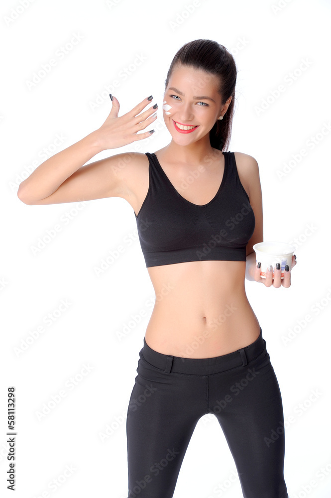 Beautiful face of young woman with cosmetic cream on a cheek Beautiful face of young woman with cosmetic cream on a cheek