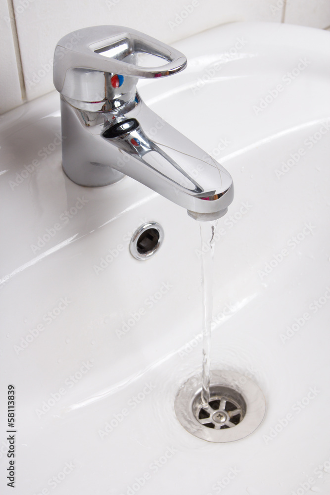 Fototapeta premium Bathroom interior with white sink and faucet