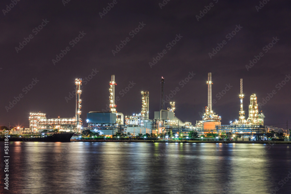 oil industry with river night light