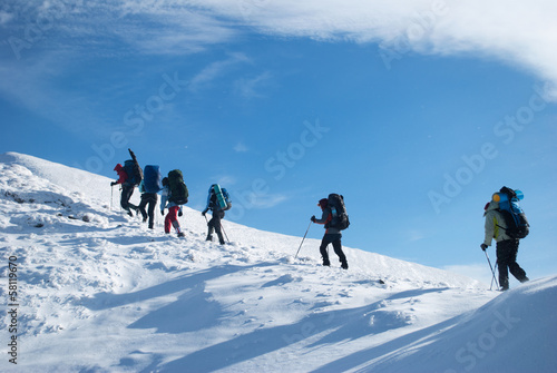 hikers in a winter mountain