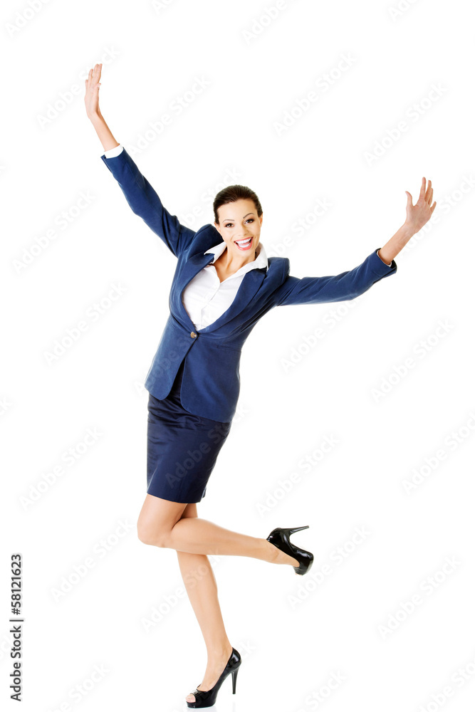 Attractive businesswoman with hands up. Cheerful.