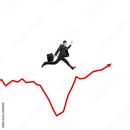 businessman jumping on graph