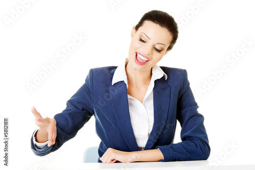 Attractive woman holding copy spacein the air. photo