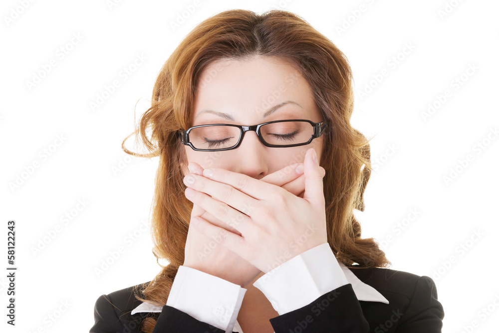 Beautiful business woman with closed eyes, covering her mouth. Beautiful business woman with closed eyes, covering her mouth.