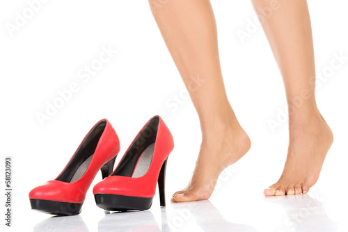 Female legs and red heels.