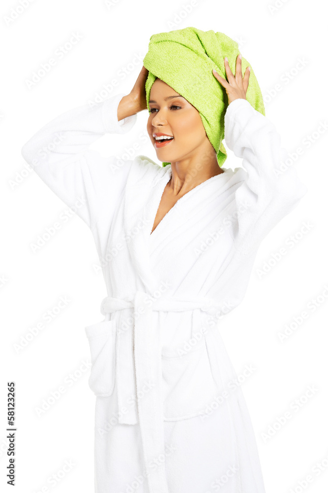 Attractive woman wrapped in towel with turban.